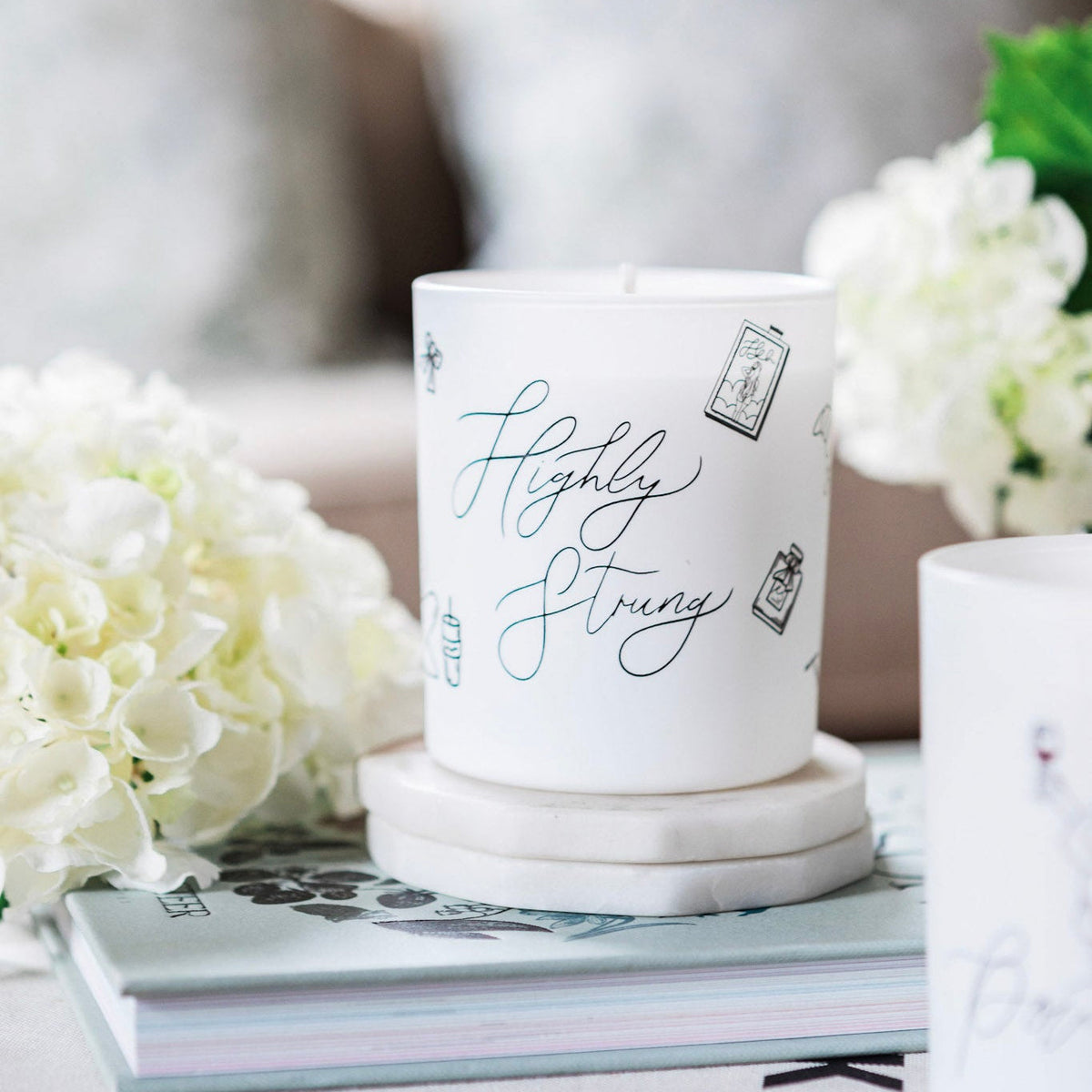 Natural wax glass candle from Avalon Home UK, featuring a sleek design and soft glow in a highly strung style.