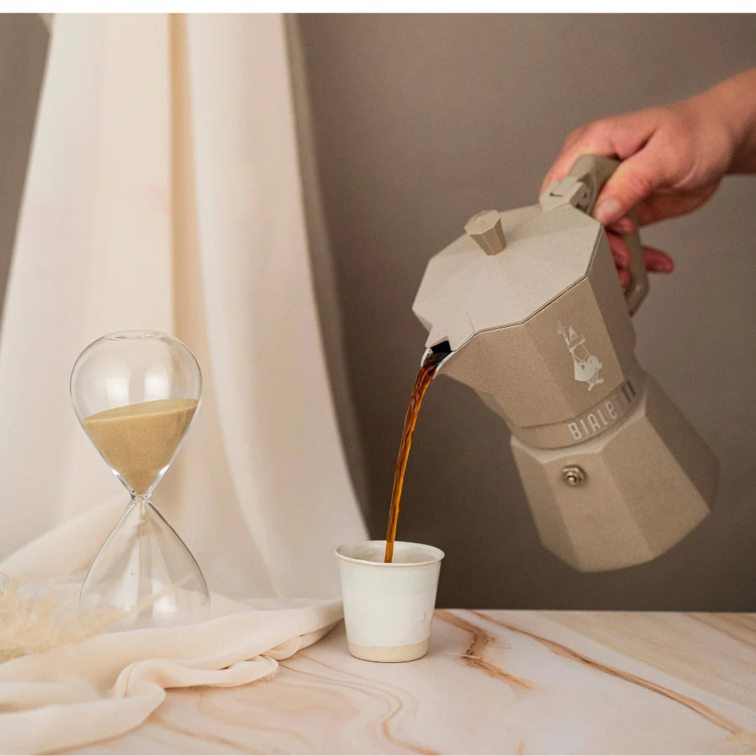 Bialetti Moka Octagonal Induction coffee maker with stainless steel body and black handle, designed for induction stovetops.