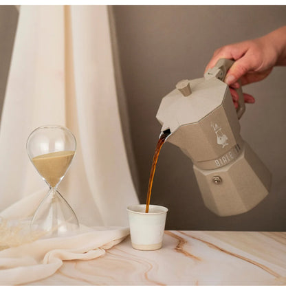 Bialetti Moka Octagonal Induction coffee maker with stainless steel body and black handle, designed for induction stovetops.