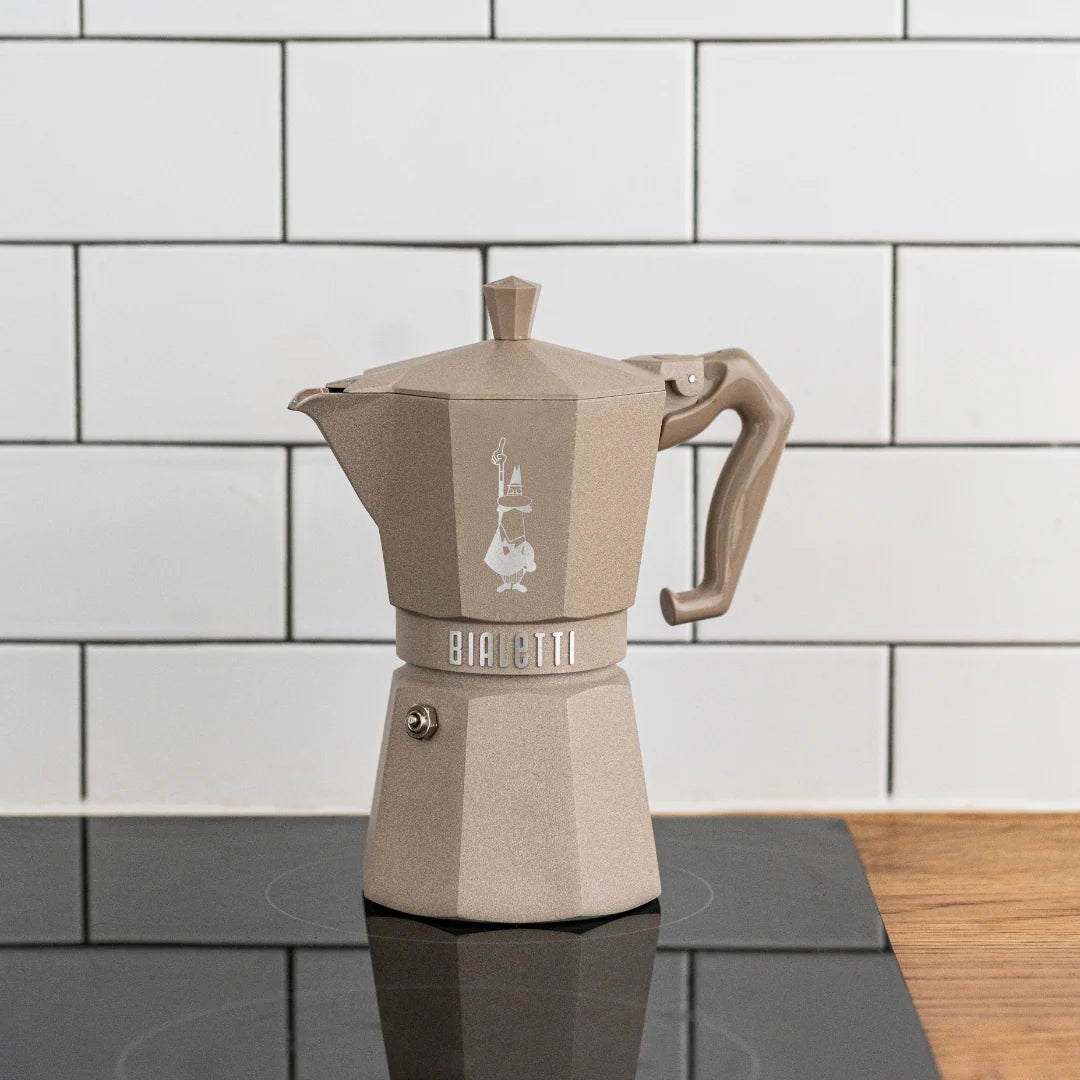Bialetti Brew Italia Moka Octagonal Induction coffee maker with stainless steel body and black handle, designed for induction stovetops.