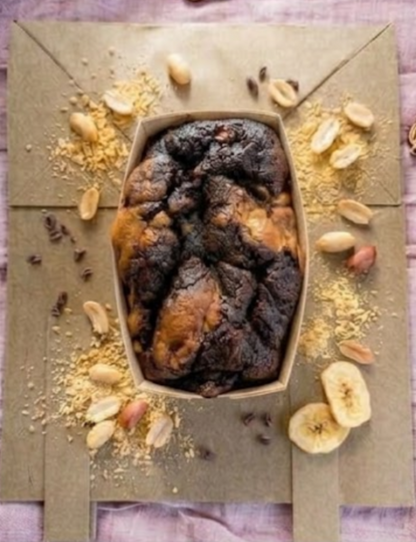 Assorted gluten-free and dairy-free baked goods in The Healthy Cake Company Free From Mixed Box, displayed on a white plate.