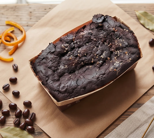 Vegan Chocolate Orange Free From Cake by The Healthy Cake Company, sliced to show orange-flavored chocolate cake interior