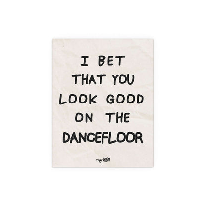 Arctic Monkeys poster featuring artwork for "I Bet You Look Good on the Dancefloor" by Glow On Prints, displayed on a wall.