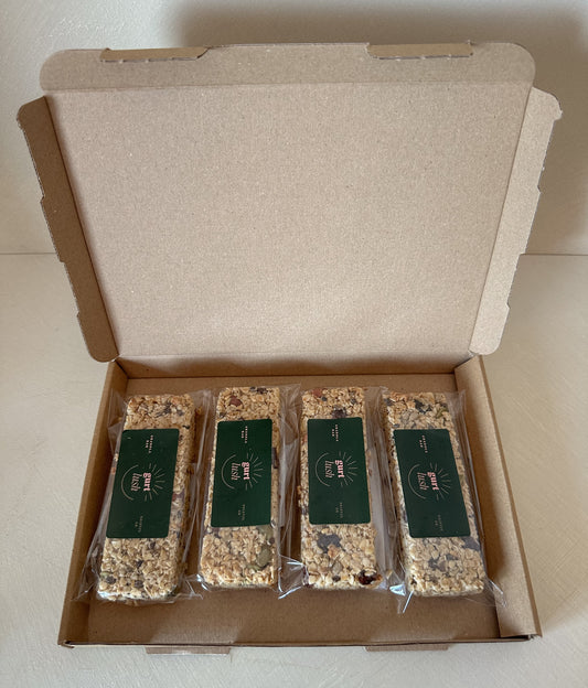 Gurt Lush Food Co granola bars in various flavors, showing close-up of the snack bars with textured oats and ingredients.