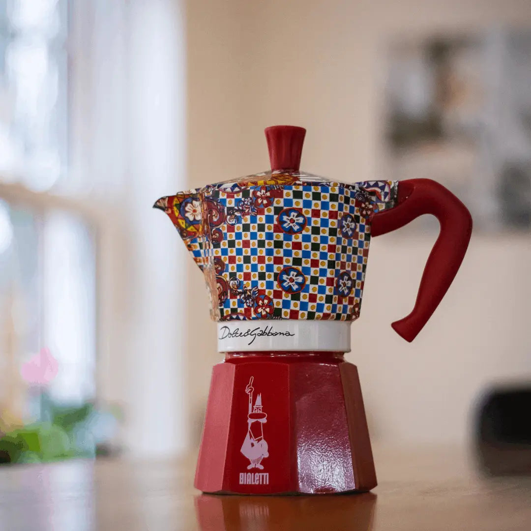 Bialetti X Dolce&Gabbana Sicilian Cart Moka Express coffee maker with ornate Italian design and Bialetti hardware details.
