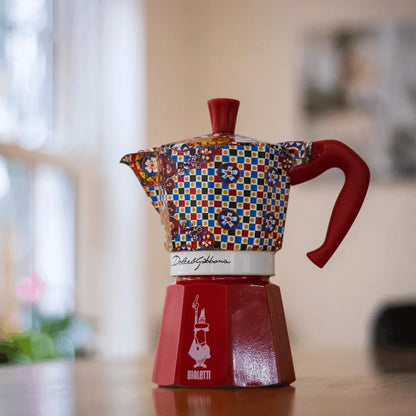 Bialetti X Dolce&Gabbana Sicilian Cart Moka Express coffee maker with ornate Italian design and Bialetti hardware details.