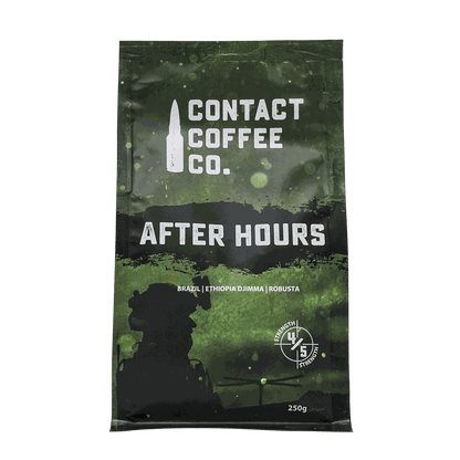 Freshly brewed after hours coffee from Contact Coffee Company Ltd., showing a steaming cup of rich, dark coffee on a wooden table.