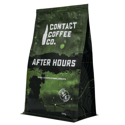 A cup of After Hours Coffee by Contact Coffee Company Ltd. with steaming brewed coffee in a white ceramic mug.