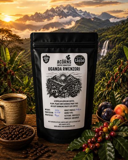 Acorns Coffee & Cake Uganda Rwenzori Kisinga medium roast coffee packaging with scenic imagery and fruity notes.