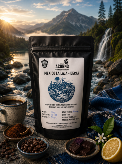 Acorns Coffee & Cake Mexico Mountain Water Decaf coffee bag featuring citrus and chocolate notes on smooth packaging.