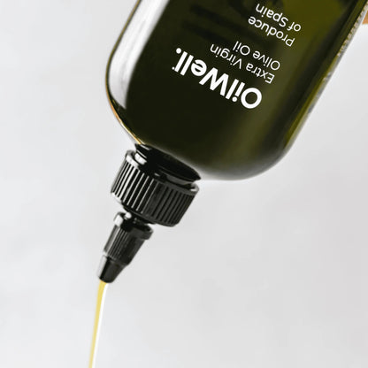 Light and smooth Spanish extra virgin olive oil in a clear glass bottle with a green screw cap, labeled OilWell.