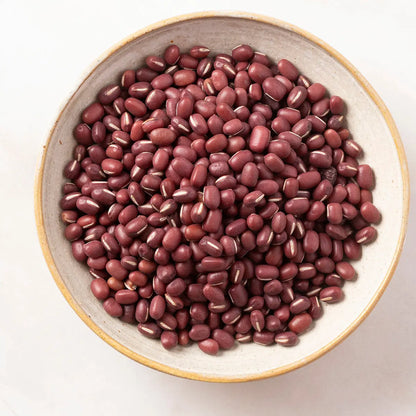 Whole Food Earth aduki beans, small reddish-brown beans in a bowl, showcasing fresh, uncooked beans from the beans and pulses category.