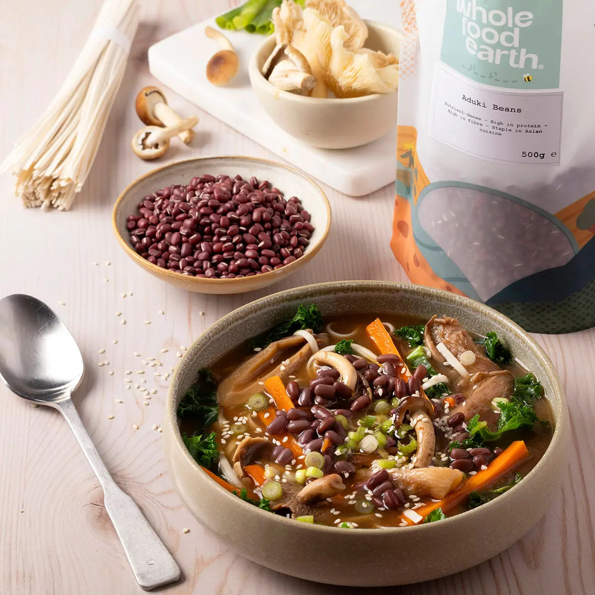 Whole Food Earth aduki beans in a bowl with fresh vegetables, showcasing healthy beans and pulses for nutritious meals.