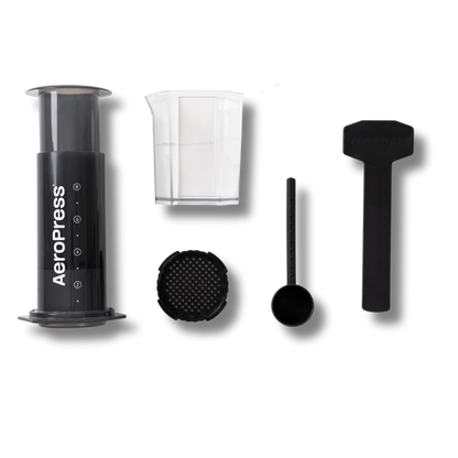 XL AeroPress Travel Coffee Maker by Contact Coffee Company Ltd., showing the compact coffee brewing gear with accessories and components.