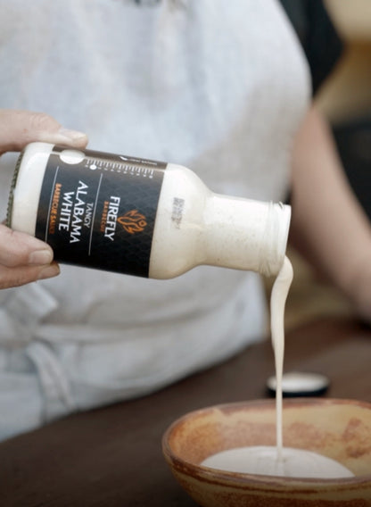Alabama White BBQ Sauce by FireFly Barbecue drizzled on a turkey, showcasing the creamy, tangy white sauce used in barbecue.