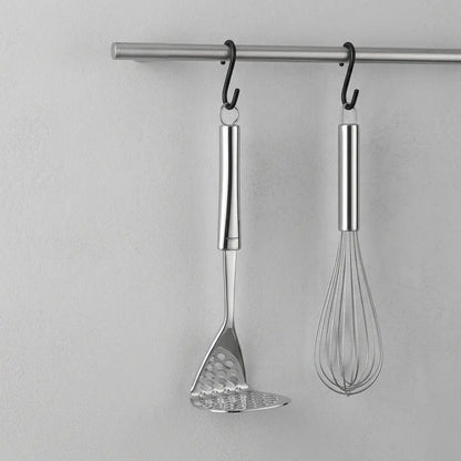 Glassware UK Smart Potato Masher from Ghidini, a sleek kitchen utensil with a sturdy handle and mashing plate, ideal for preparing potatoes.
