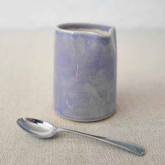 Amethyst purple small ceramic jug with a matching spoon, designed by Katie L Thompson Designs, ideal for serving or decor.