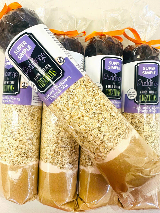 Crafty Cook Apple and Blackberry Flapjack Mix in a bowl, gluten-free dessert mix with fresh fruit pieces, ready to bake.