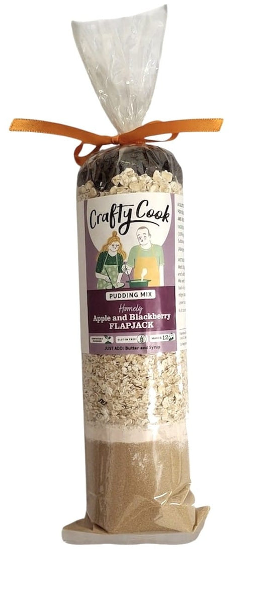 Gluten-free apple and blackberry flapjack mix by Crafty Cook, showing a bag of the all-purpose baking blend with fresh fruit.