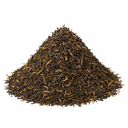 Assam Mangalam FTGFOP1 high-quality tea leaves from High Teas, displayed in a neat pile showcasing their rich, dark green color.