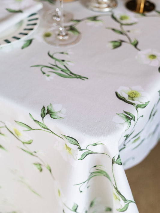 Snowdrop and hellebore floral tablecloth by Avalon Home UK, featuring a spring-inspired botanical design for elegant table decor.