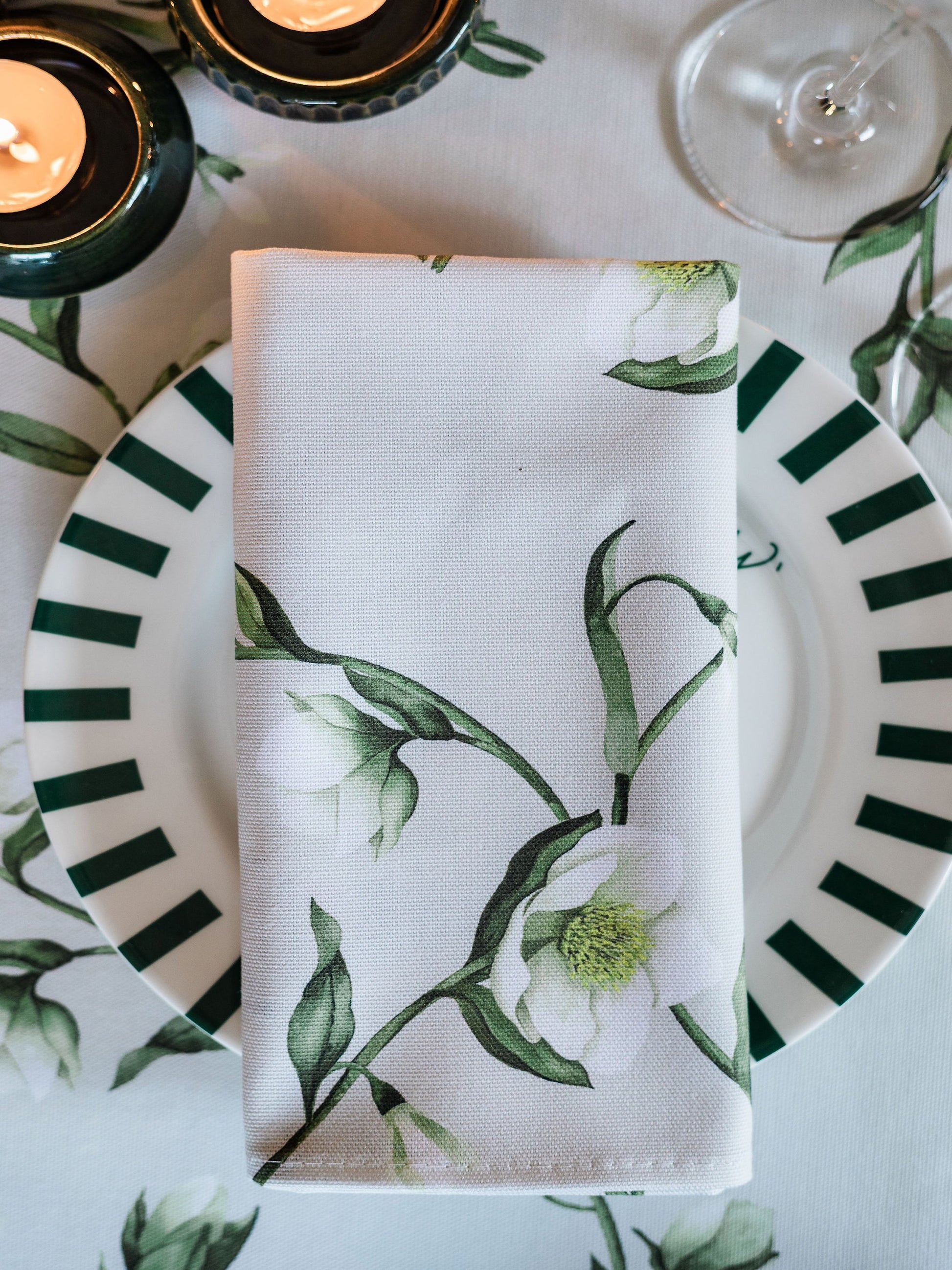 Pair of Avalon Home UK snowdrop and hellebore floral napkins with spring and summer design, featuring botanical patterns.