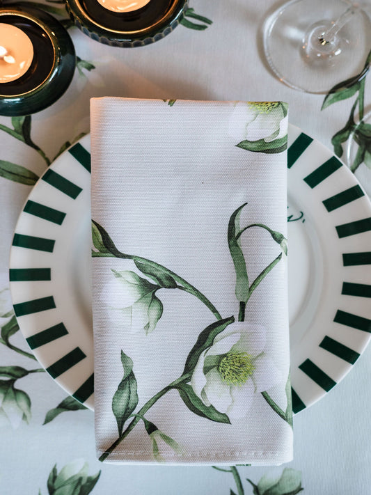 Pair of Avalon Home UK snowdrop and hellebore floral napkins with spring and summer design, featuring botanical patterns.
