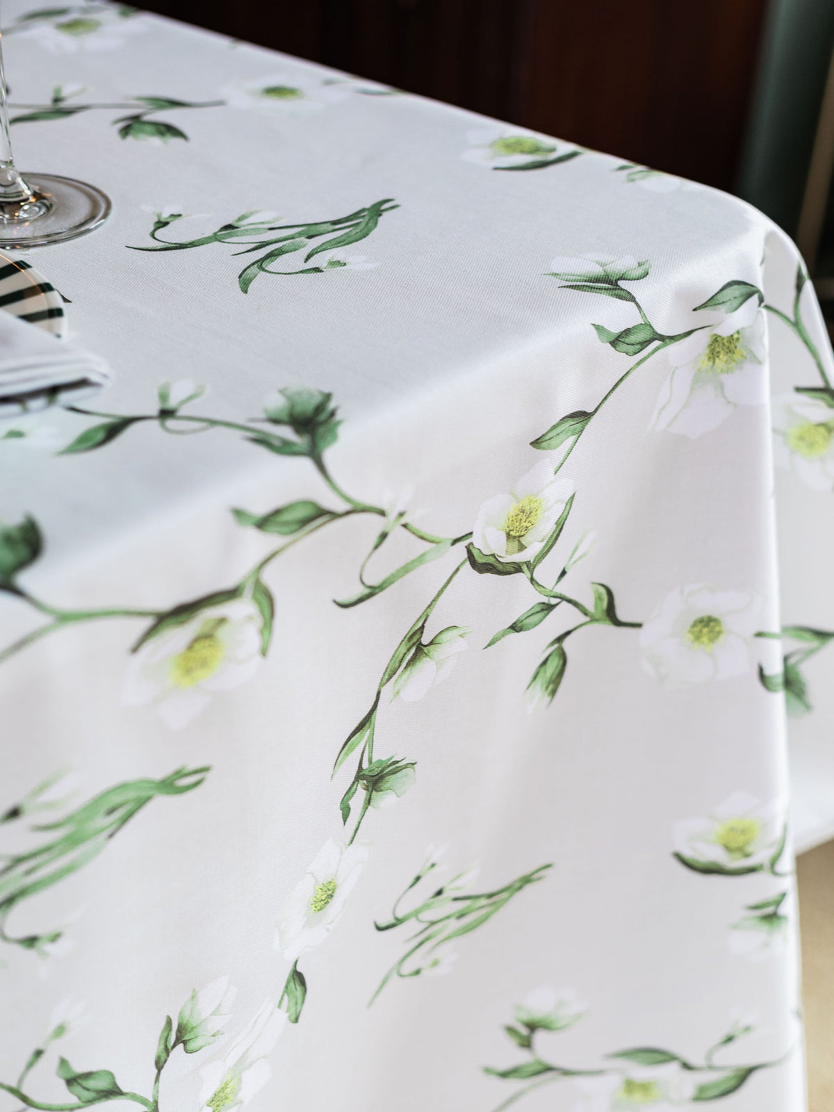 Snowdrop and hellebore floral tablecloth by Avalon Home UK, featuring a spring-inspired botanical design on a fabric surface