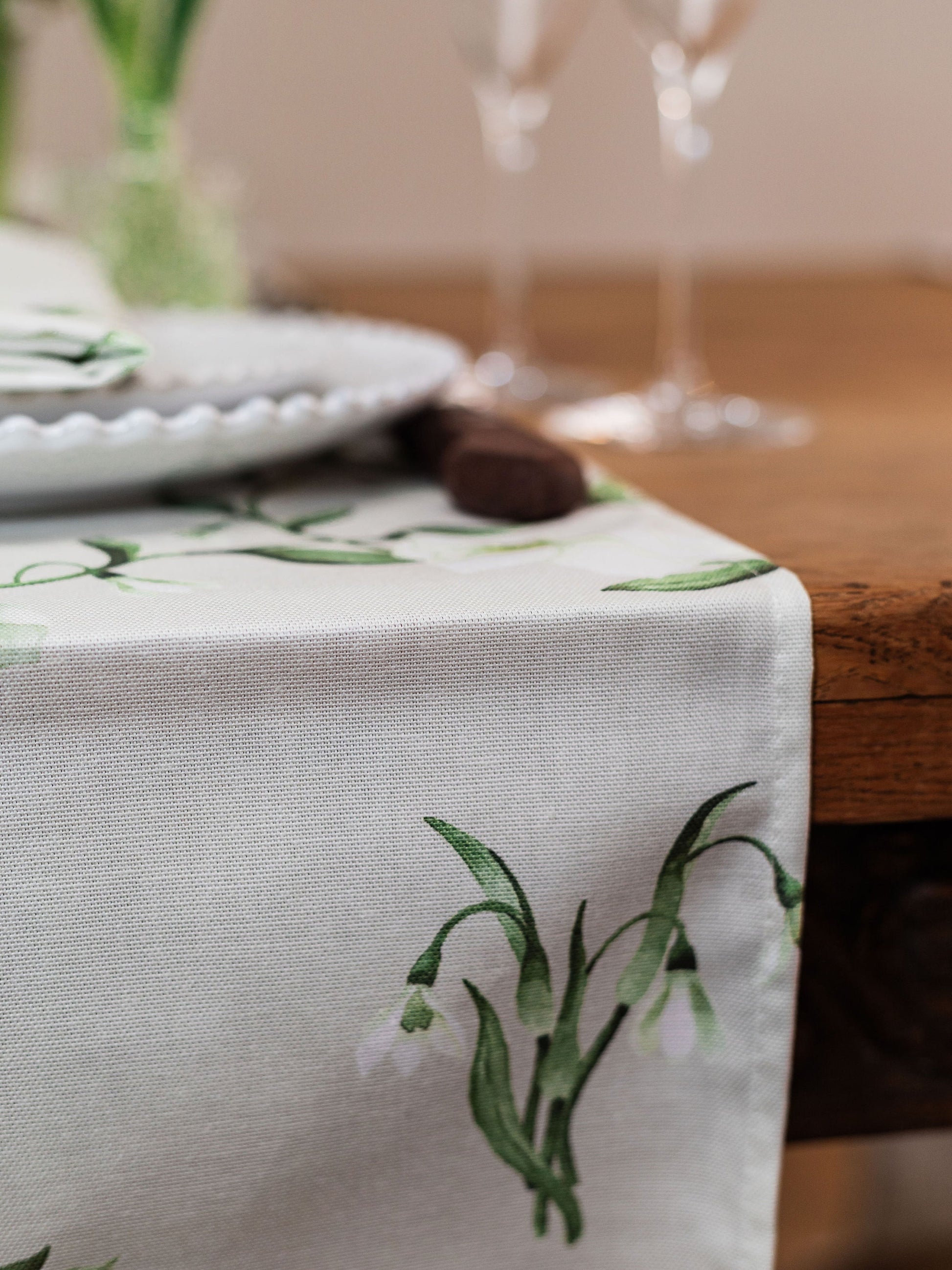 Spring-themed table runner featuring snowdrop and hellebore floral designs for elegant home decor by Avalon Home UK