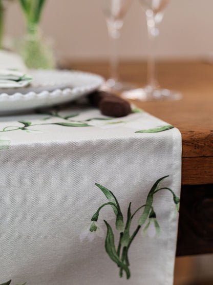 Spring-themed table runner featuring snowdrop and hellebore floral designs for elegant home decor by Avalon Home UK