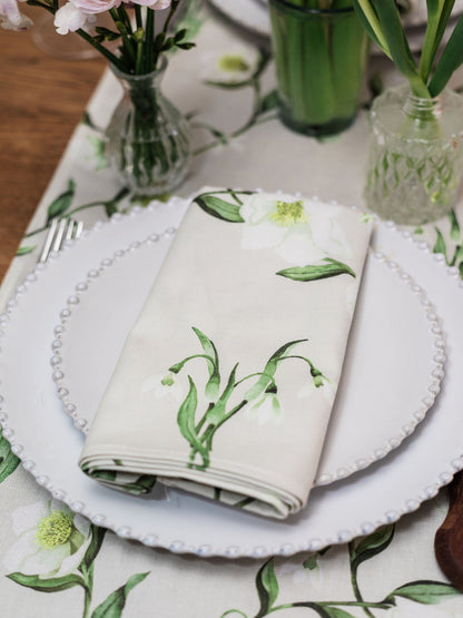 Pair of Avalon Home UK snowdrop and hellebore floral napkins with spring and summer design, perfect for elegant table settings.