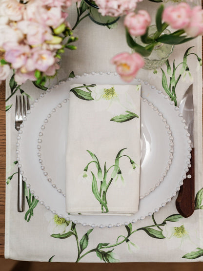 Pair of Avalon Home UK snowdrop and hellebore floral napkins with elegant spring and summer botanical designs.