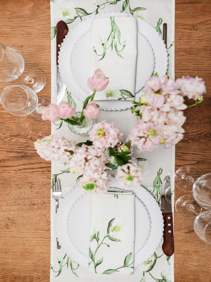 Elegant table runner featuring snowdrop and hellebore floral design by Avalon Home UK, perfect for spring and summer table settings.