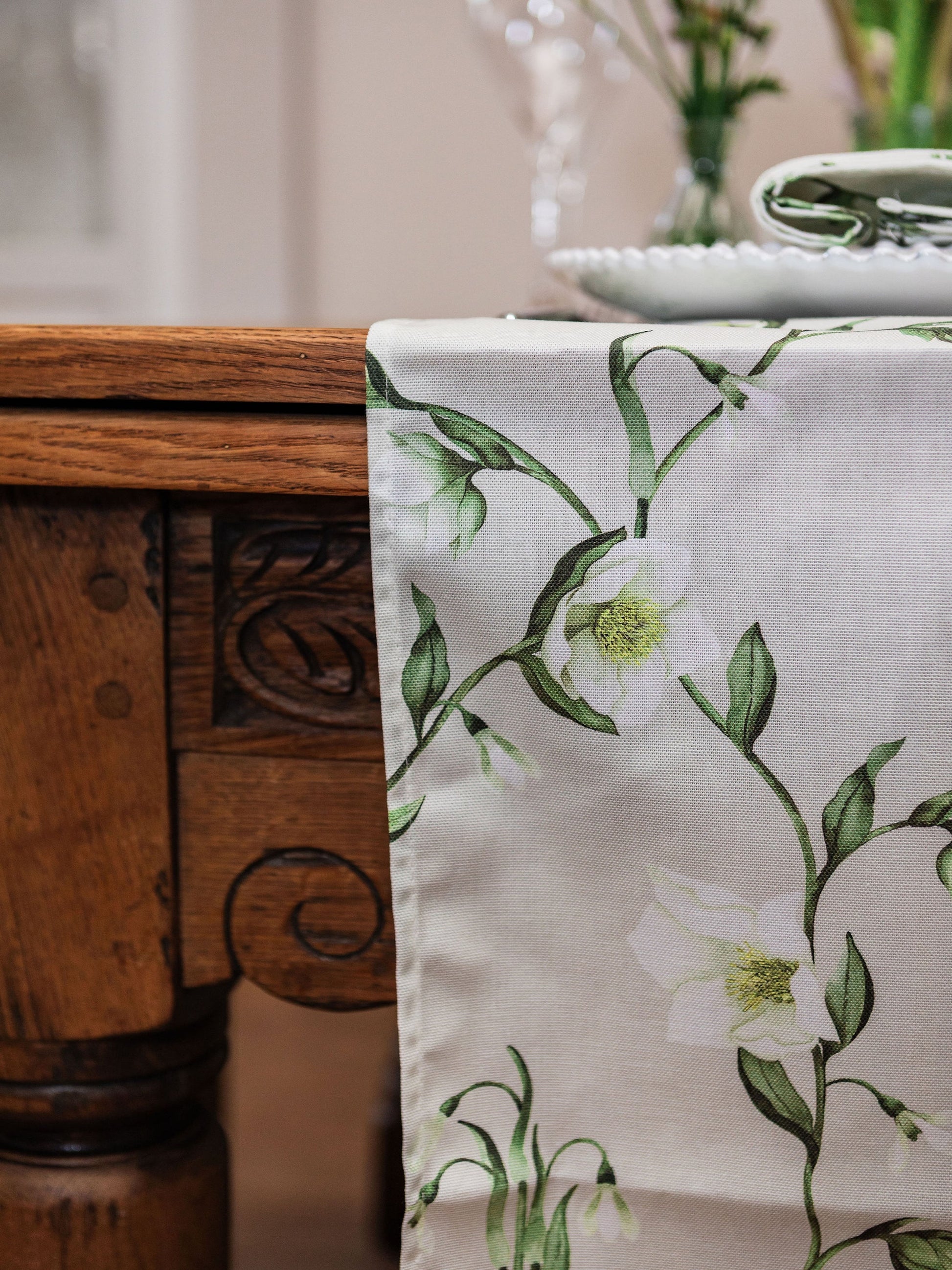 Spring-themed table runner featuring snowdrop and hellebore floral design by Avalon Home UK, perfect for spring decor.