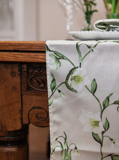 Spring-themed table runner featuring snowdrop and hellebore floral design by Avalon Home UK, perfect for spring decor.