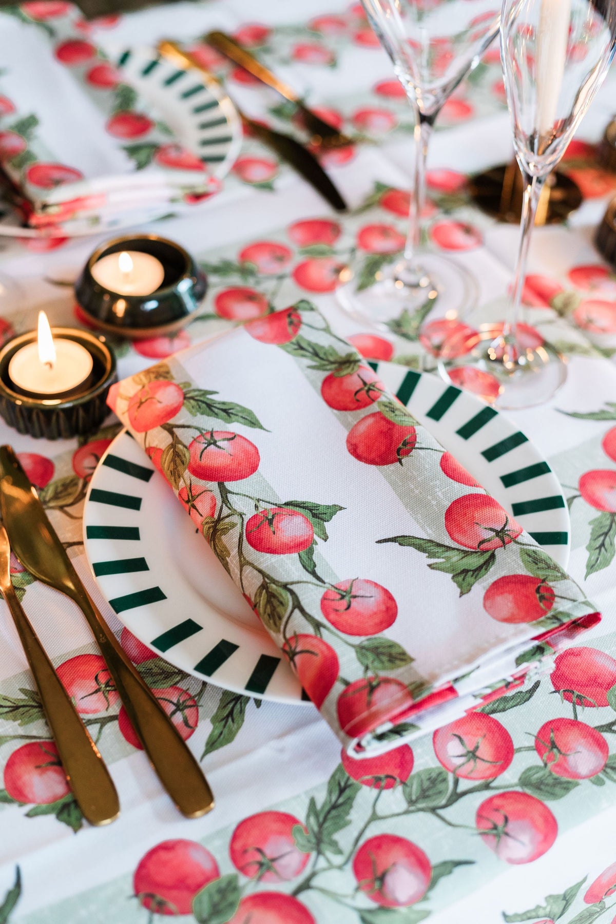 Pair of Avalon Home UK Vine Tomato napkins featuring vibrant tomato vine print for elegant table setting.