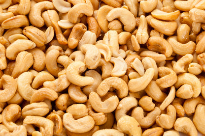 Roasted and salted cashew nuts in a bowl, Whole Food Earth nuts and seeds product, showing golden-brown, crunchy cashews.