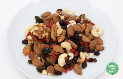 Mixed fruits and nuts in a bowl, Whole Food Earth speciality snack with colorful dried fruits and crunchy nuts.