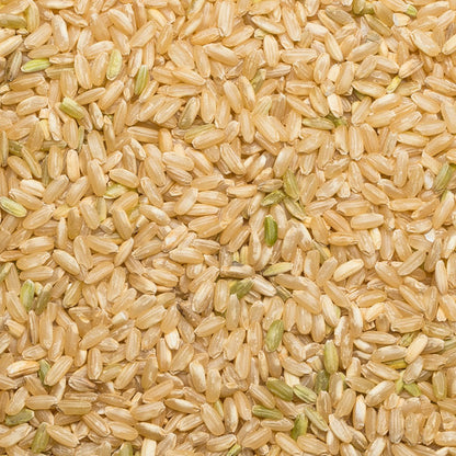 Whole Food Earth long grain brown rice in a clear bag, showing the light brown, textured rice grains suitable for cooking.