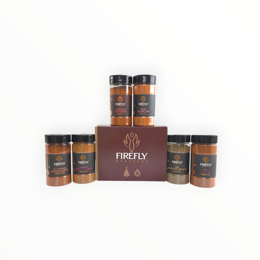 Spicy BBQ Christmas Six Pack Gift Box from FireFly Barbecue, featuring assorted barbecue rubs in festive packaging.