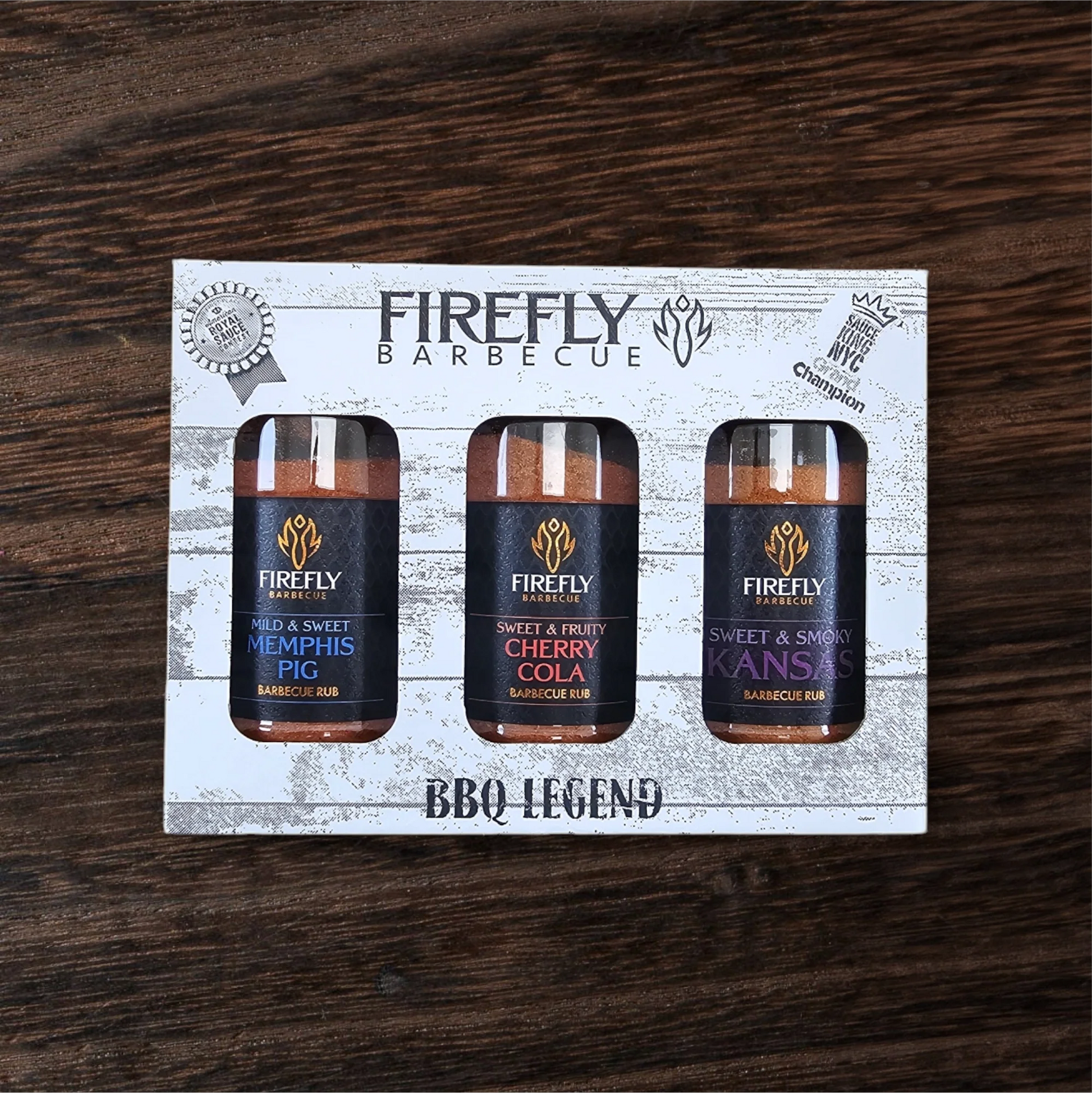 FireFly Barbecue BBQ Legend gift set with three sweet BBQ rubs in colorful containers, ideal for grilling enthusiasts.