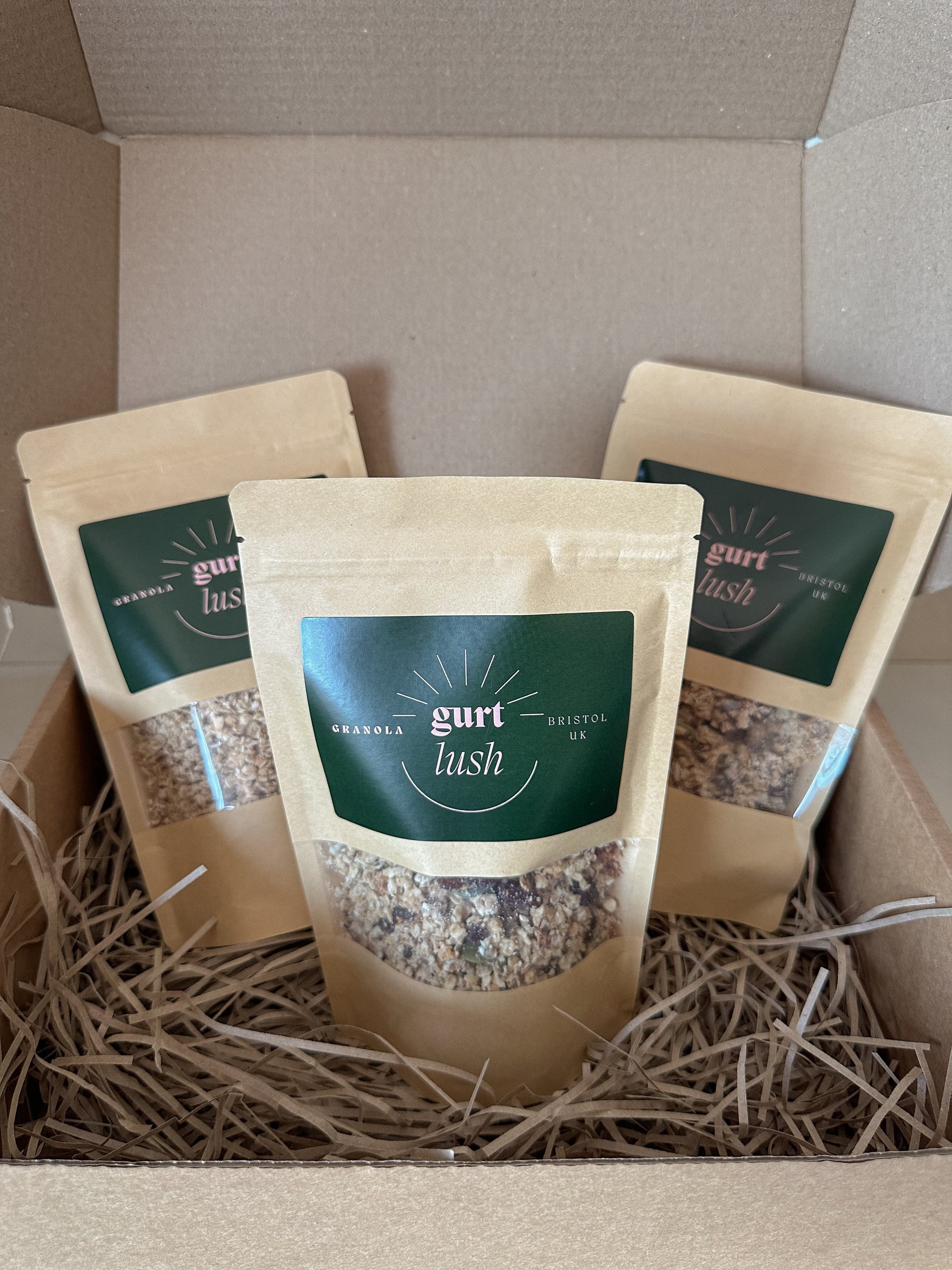 Gurt Lush Food Co granola taster box with assorted granola varieties in a gift box, showcasing different textures and flavors.