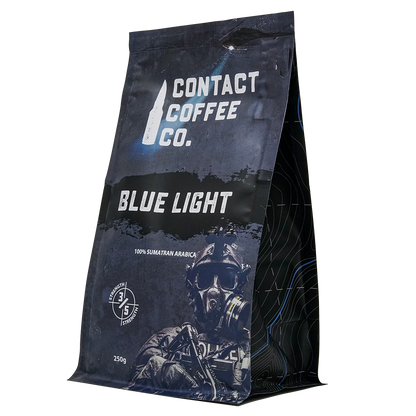 Blue Light Coffee from Contact Coffee Company Ltd., a fresh brewed coffee in a mug with a blue light background.