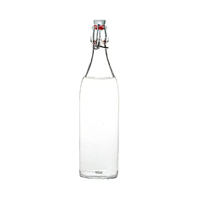 Clear Bormioli Rocco 1-liter round swing top glass bottle with metal clasp and rubber seal for storing liquids.