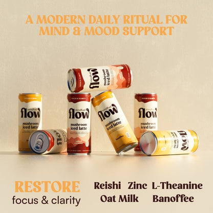Reishi oat latte with banoffee flavor in a cup, showcasing creamy drink topped with a sprinkle of spices, from Mindfuel Flow.