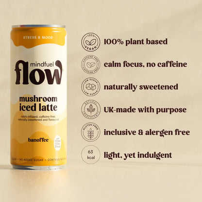 Reishi oat latte with banoffee flavor from Mindfuel Flow, featuring a creamy drink in a glass with a spoon and latte art.