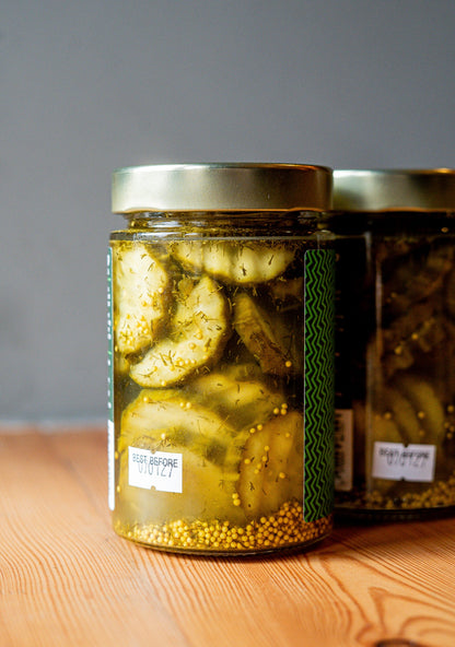 Back view of PICKLEBITS Organic Dill & Garlic Burger Pickles jar showing the label and jar shape.