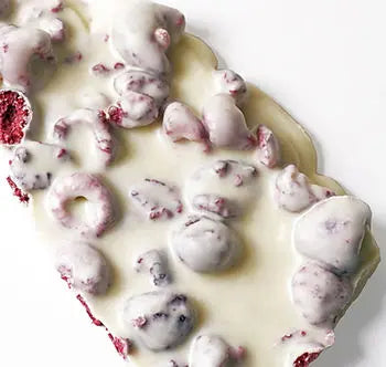 Handmade white chocolate and raspberry berry delicious dessert by Gorvett & Stone, featuring fresh raspberries and creamy white chocolate.