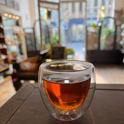 Loose leaf English Breakfast black tea from Porter Hill Tea Company, showing dark tea leaves in a clear glass jar.