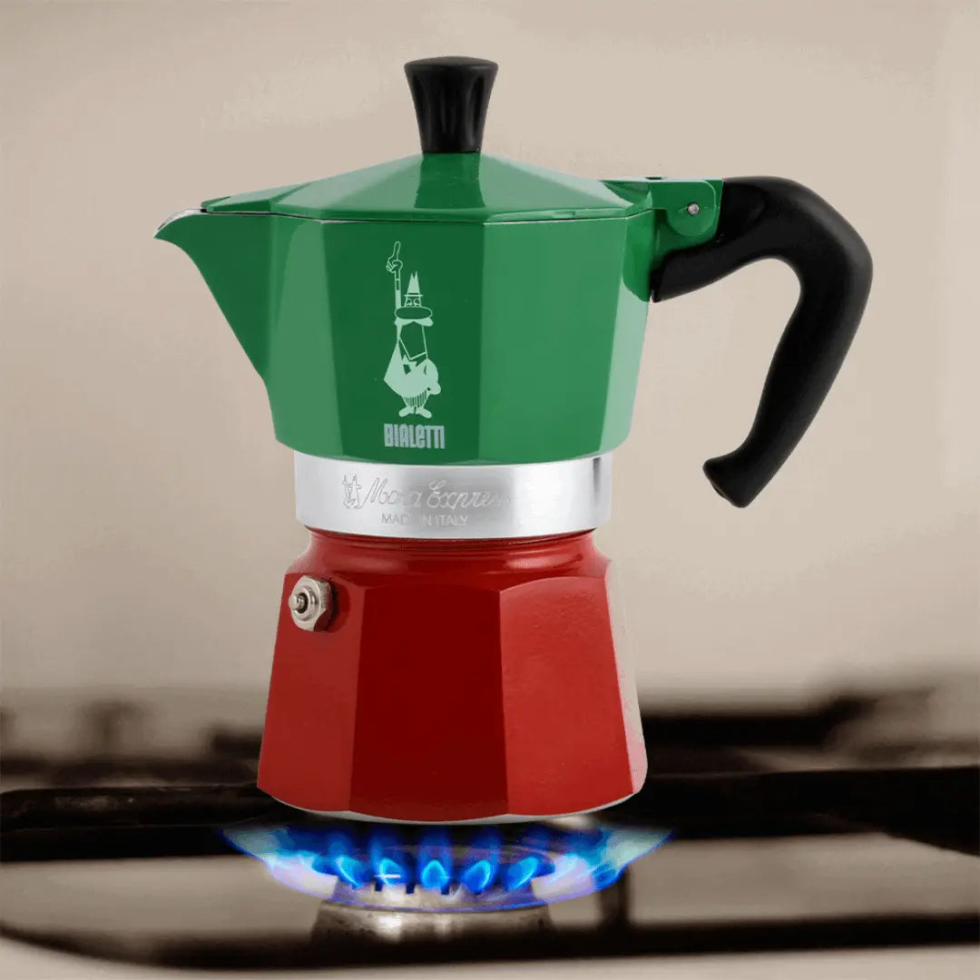 Bialetti Moka Express Tricolore Italia stovetop coffee maker with red, white, and green design on shiny metal surface, Brew Italia branding